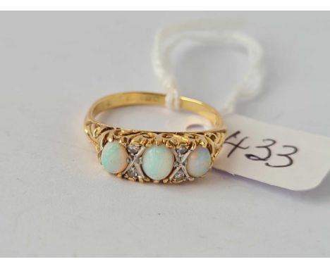 A seven stone opal and diamond ring 18ct gold size N     3.8 gms 