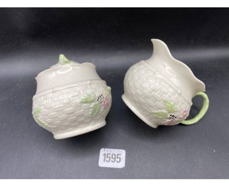 A Belleek cream jug and sugar basin and cover