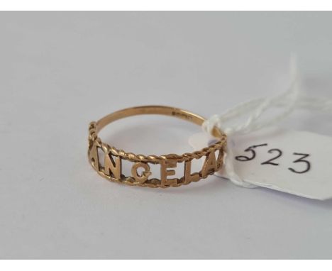 A gold ring cut out to spell Angela 9ct size O  