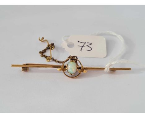 An antique opal set 15ct gold bar brooch with safety chain 3.9g inc