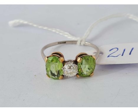 A PLATINUM PERIDOT AND DIAMOND THREE STONE RING SIZE R      3.5 GMS 