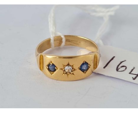 A sapphire and white stone ring gypsy set ring size K set in high carat        2.5 gms