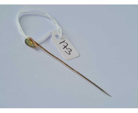 A fine pear shaped opal stick pin set in gold