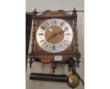 A vintage old wall clock, with weights and pendulum, 39cm in height approx. 
