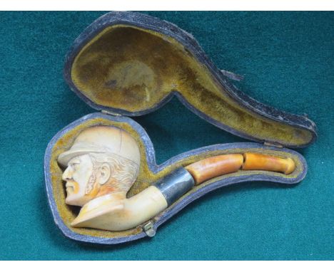 CASED CARVED VINTAGE FIGURE FORM MEERSCHAUM PIPE WITH SILVER BANDING AND AMBER COLOURED MOUTHPIECE (AT FAULT) 