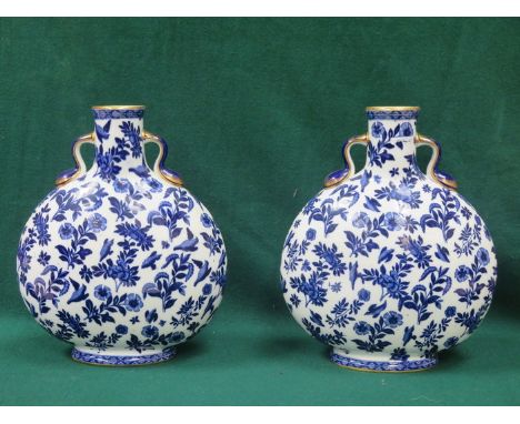 PAIR OF FLORAL DECORATED AND GILDED BLUE AND WHITE CERAMIC FLASKS, APPROXIMATELY 32cm HIGH (AT FAULT) 