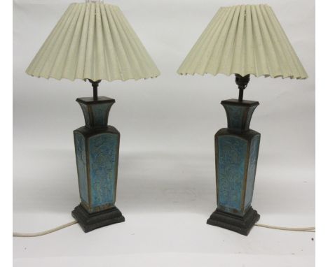 Pair of Chinese pottery green glazed table lamps of faceted form with scroll decoration (2)