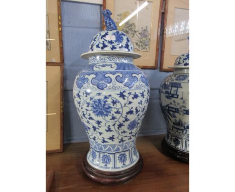 Chinese porcelain jar and cover, the baluster body decorated with floral design, the cover also with similar design and Dog o