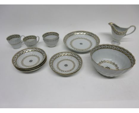 Group of late 18th century tea wares, probably Worcester, comprising 2 cups, 2 tea bowls, saucers, helmet shaped milk jug, sl