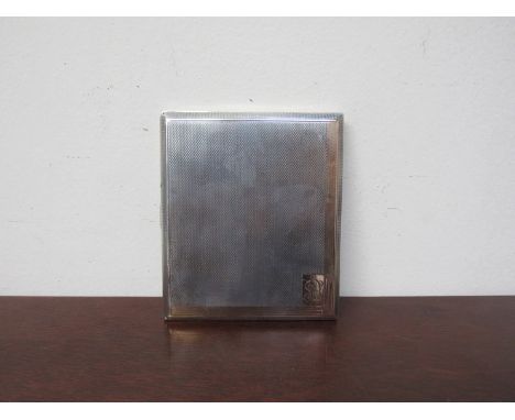 A silver cigarette case with engine turned design, rose gold surround, London 1934, 129g    