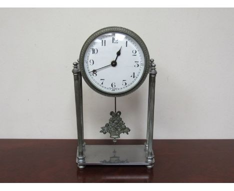 A plated metal mantel clock 