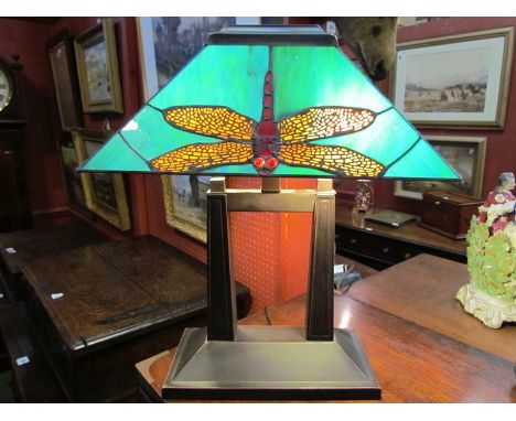 A Tiffany style table lamp with dragonfly decoration on a twin column stem to rectangular base 