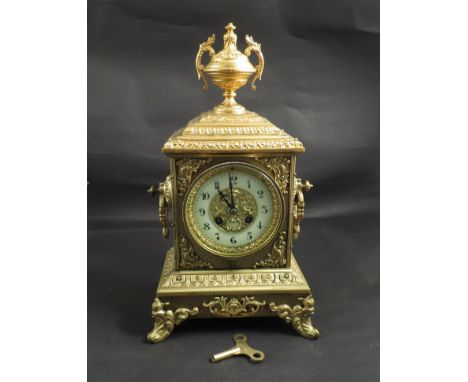 A late 19th Century brass and ormolu mantel clock of decorative Rococo design, French 8 day bell striking movement, Arabic en