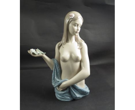 A Nao figure of young female bust holding a rose, 38cm tall