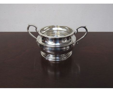 A silver twin handled sucrier, stepped circular base, Birmingham 1931, 241g