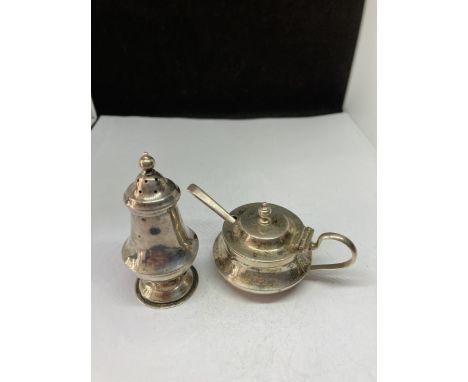 A STERLING SILVER CRUET AND SPOON SET