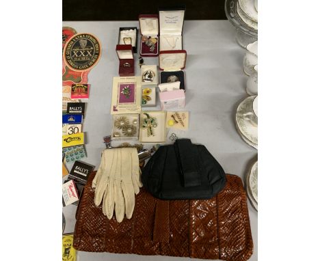 A QUANTITY OF COSTUME JEWELLERY TO ALSO INCLUDE ENAMEL BADGES, VINTAGE HANDBAGS AND GLOVES