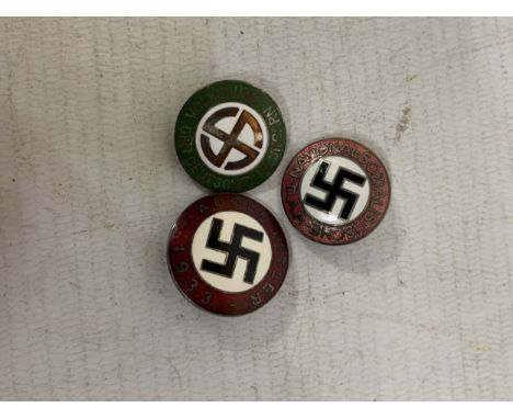 A COLLECTION OF THREE NAZI GERMANY ENAMEL BADGES TO INCLUDE VOLKSBUND, ADOLPH HITLER 1938 AND NSDAP