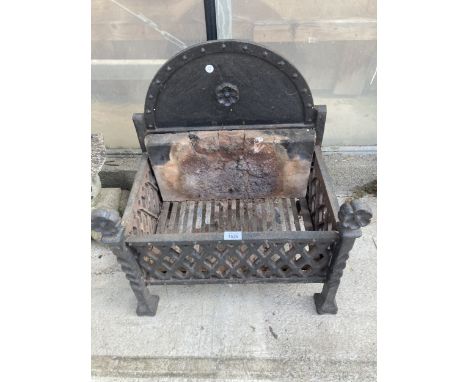 A DECORATIVE HEAVY CAST IRON FIRE GRATE