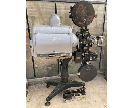 A LARGE VINTAGE BRITISH THOMSON HOUSTON CINEMA PROJECTOR ON A HEAVY CAST IRON BASE