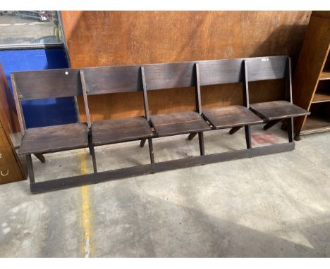 A SET OF FIVE EARLY 20TH CENTURY FOLDING THEATRE CHAIRS