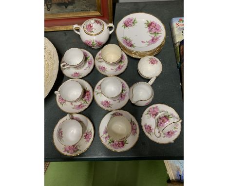 A GROSSVENOR BONE CHINA TEASET TO INCLUDE TEA CUPS, SAUCERS, A SUGAR AND CREAMER ETC