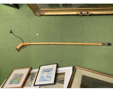 A BIRD OF PREY, HAND CARVED WALKING STICK WITH GLASS EYES