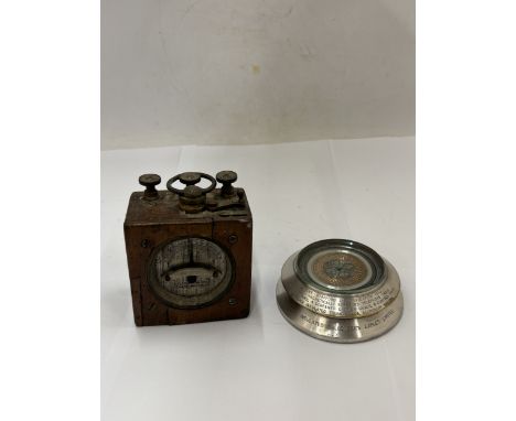 A TELEGRAPH WORKS SILVERTOWN LONDON GALVANOMETER AND A PAPERWEIGHT SHOWING A CROSS SECTION OF BRITISH INSULATED CABLES