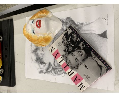 A QUANTITY OF MARILYN MONROE ITEMS TO INCLUDE A POSTER, CERAMIC WALL MASK AND 30 POSTCARDS