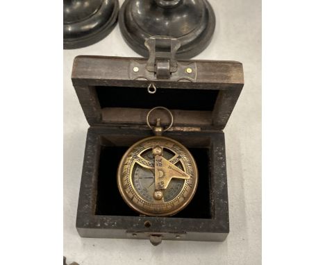 A BOXED BRASS SUNDIAL COMPASS