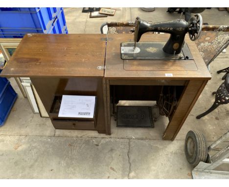 A SINGER TREADLE SEWING MACHINE IN CABINET, NUMBER Y8843968