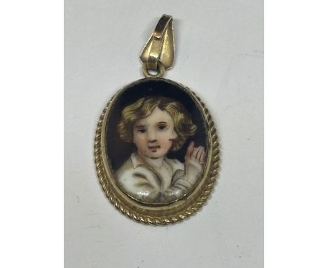 A 9 CARAT GOLD PENDANT WITH A HANDPAINTED PORTRAIT OF A YOUNG BOY