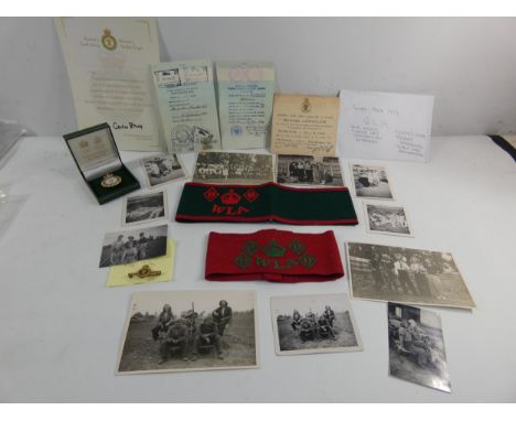 A COLLECTATION OF WORLD WAR II WOMENS LAND ARMY MEMROBILIA TO INCLUDE TIE PIN, TWO ARM BANDS, RELEASE CERTIFICATE, PHOTOS, GO