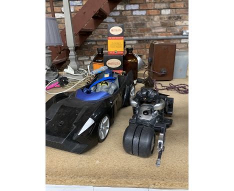 A LARGE BATMOBILE AND A LARGE BATMAN MOTORBIKE