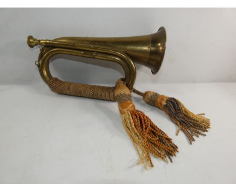 A VINTAGE BRASS BUGLE