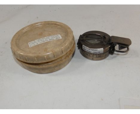 A BRITISH ARMY MARCHING COMPASS AND A GERMAN WORLD WAR II BUTTON DISH BOX