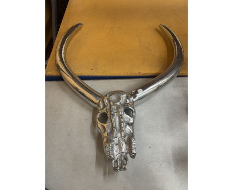 A CHROME STEER SKULL AND HORNS WALL DECORATION
