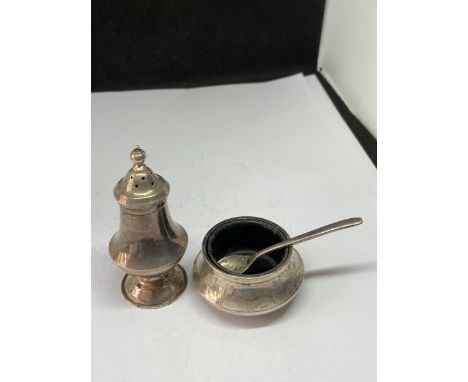 A STERLING SILVER CRUET SET WITH SPOON