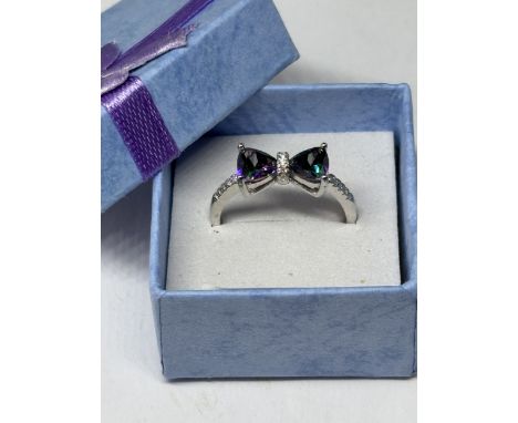A MARKED 925 MULTI TOURMALINE BOW DESIGN RING WITH CUBIC ZIRONIAS SIZE S IN A PRESENTATION BOX