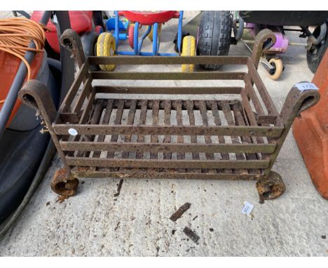 A VINTAGE METAL FIRE GRATE