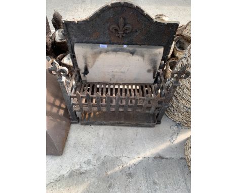 A HEAVY CAST IRON FIRE GRATE