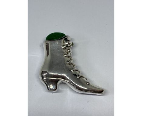 A SILVER BOOT DESIGN PIN CUSHION