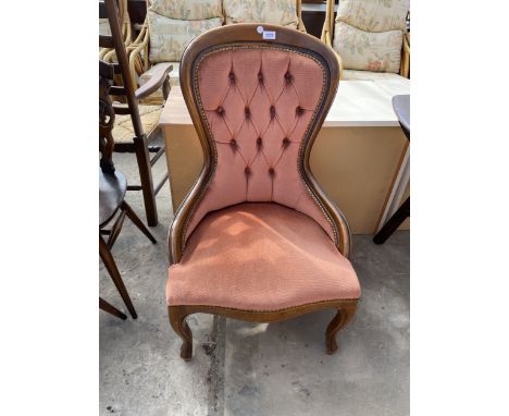 A VICTORIAN STYLE SPOON BACK LOUNGE CHAIR