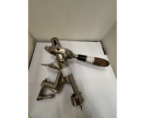 A VINTAGE SWISS MADE BAR MOUNTED CORKSCREW