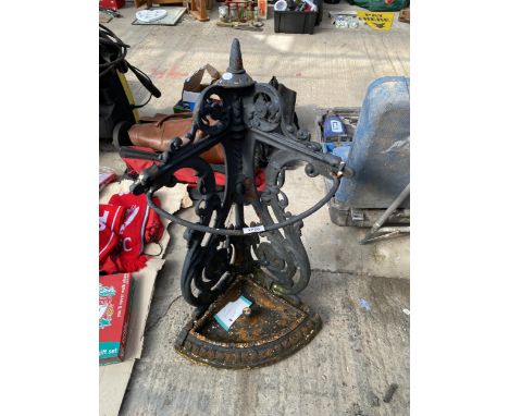 A DECORATIVE VINTAGE CAST METAL CORNER STICK STAND