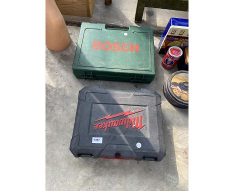 A MILWAUKEE IMPACT DRIVER WITH CHARGER AND CARRY CASE AND A BOSCH DRILL WITH CHARGER AND CARRY CASE