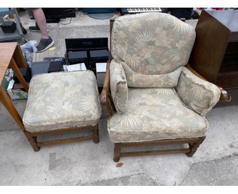 AN ERCOL ELM FRAMED EASYCHAIR AND STOOL