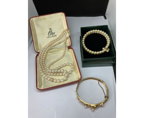 THREE PEARL ITEMS TO INCLUDE A CIRO DOUBLE STRAND IN ORIGINAL BOX, A DOUBLE STRAND BRACELET AND A YELLOW METAL PEARL BANGLE