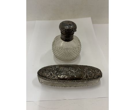 TWO GLASS ITEMS WITH SILVER LIDS AN OVAL TRINKET DISH WITH A CHESTER HALLMARK AND A BOTTLE WITH A BIRMINGHAM