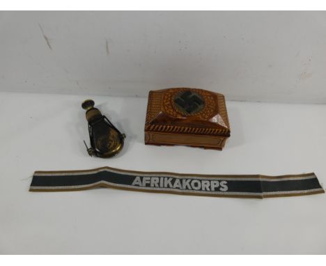 A WOODEN BOX WITH CARVED SWASTIKA DECORATION, AFRIKA KORPS BAND AND A FOLDING MONOCULAR